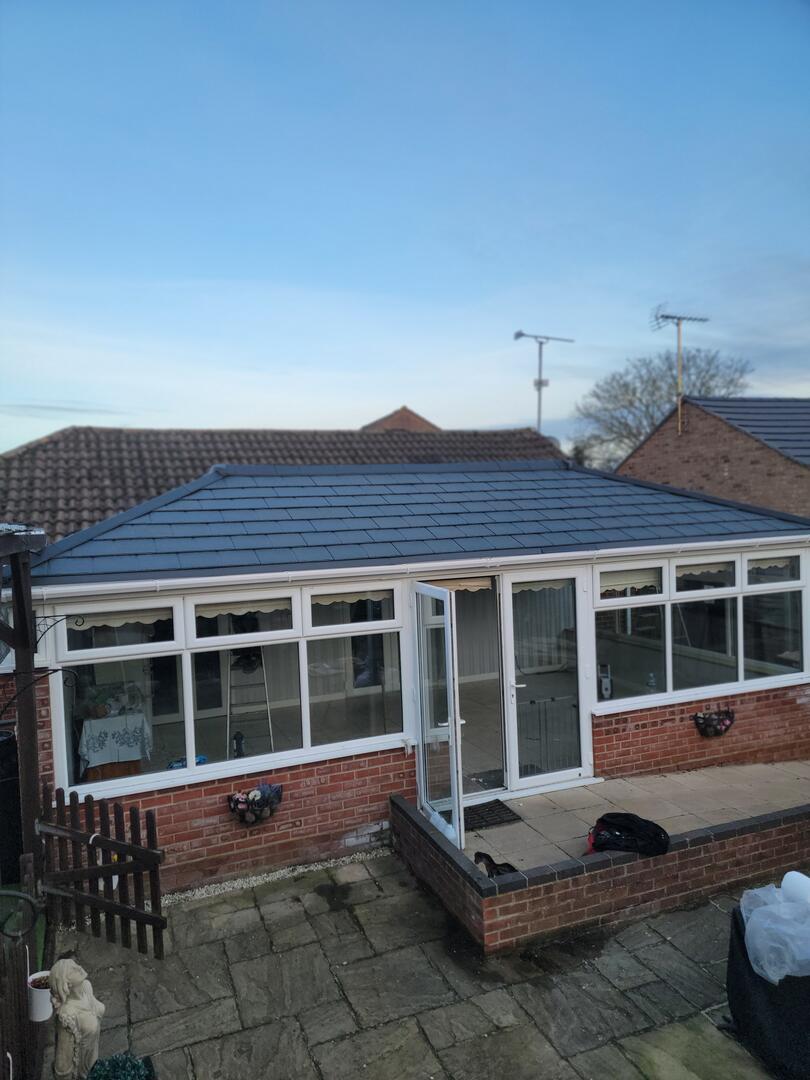 Large Edwardian Georgian conservatory with new Grey tiled roof — after transformation
